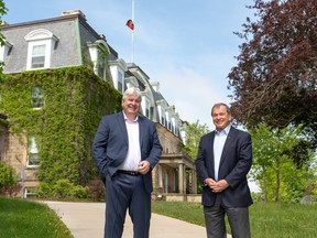 Paul J. Mazerolle, UNB president and vice-chancellor with the Honourable Frank McKenna. SUPPLIED