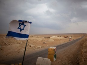 An Israeli flag flies at a checkpoint at the Israeli-Egyptian border in a file photo. Nov. 30 is an official memorial day in Israel to mark Jews' expulsion and departure from Arab countries and Iran.