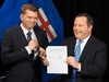 Wildrose Party leader Brian Jean, left, and Alberta PC leader Jason Kenney announce that they have reached a deal to merge the parties and create the United Conservative Party, May 18, 2017.