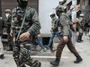 Agents from India's National Investigation Agency launch a raid in 2019.