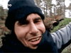 In an image from an Islamic State propaganda video, Safwan Al-Kanadi, identified as Sami Elabi from Montreal, reacts with joy at an explosion destroying a building.