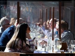 Plexiglass divides guests at the Lulu Bar in Calgary.