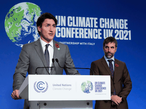 Prime Minister Justin Trudeau, left, and Environment Minister Steven Guilbeault hold a press conference at COP26 in Glasgow, on Nov. 2.