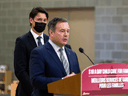 Alberta Premier Jason Kenney and Prime Minister Justin Trudeau, who generally try to avoid one another, are seen sharing a lectern in Edmonton on Monday. 