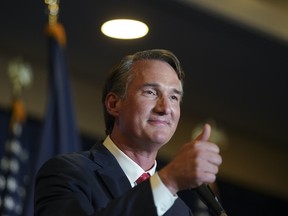 Glenn Youngkin, governor-elect of Virginia, gives a thumbs-up after speaking during an election night event in Chantilly, Virginia, U.S., on Wednesday, Nov. 3, 2021.