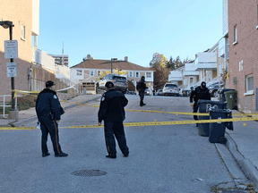 Toronto police at the scene of a fatal shooting and car crash on Oct. 28, 2021.