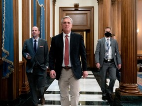 House Minority Leader Kevin McCarthy, a Republican from California, center, departs the House Chamber after speaking for more than 8 hours at the U.S. Capitol in Washington, D.C., U.S., on Friday, Nov. 19, 2021.