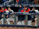 Atlanta Braves players look dejected after losing a four-hour World Series game on Sunday.