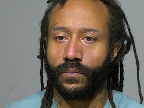 Darrell E. Brooks Jr., shown in a booking photo at the Milwaukee County Jail in Milwaukee, Wisconsin on Nov. 3, 2021. He is accused of running over the mother of his child with his red SUV on Nov. 2, and mowing down people at a parade in Waukesha Nov. 21.