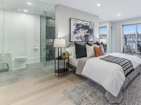 The ensuite bathroom is open to the bedroom area, but the water closet will be finished with a door as well as frosted lower glass.