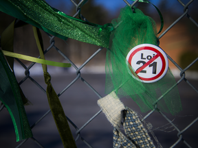A green ribbon tied in protest to the fence of Quebec's Chelsea Elementary School, where Fatemeh Anvari was recently forced out of her teaching position due to her refusal to come to work without a hijab.