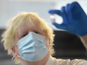 Prime Minister Boris Johnson visits Stow Health Vaccination centre in Westminster on December 13, 2021 in London, England.