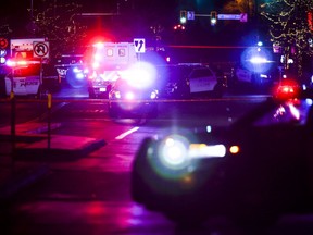 Police vehicles sit outside the Belmar shopping center where authorities say the suspect in a shooting spree that claimed five lives was shot and killed on December 27, 2021 in Lakewood, Colorado.