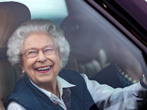 Queen Elizabeth II drives her Range Rover to the Royal Windsor Horse Show in Home Park, Windsor Castle on July 2, 2021 in Windsor, England.