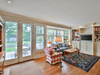 The family room has French doors to a flagstone terrace and garden.