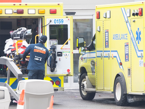 A paramedic transfers a patient from an ambulance into a hospital in Montreal on Wednesday, December 22.