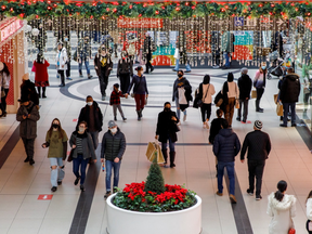 Shoppers are seen milling about the Toronto Eaton Centre shopping mall on Dec. 22. Whatever they do, all of these people are probably going to be exposed to Omicron in the coming weeks.
