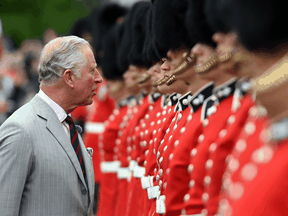 Prince Charles inspects an honour guard in Ottawa during an official visit to celebrate the 150th anniversary of Canada's founding, July 1, 2017.
