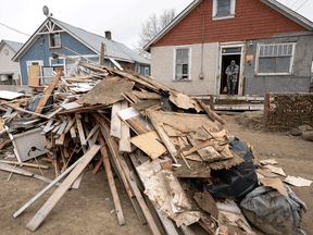 The contents to the insides of homes that were flooded are pictured on the street in Princeton, B.C., Dec. 3, 2021.