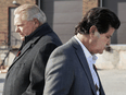 Ontario Premier Doug Ford, left, walks past Unifor President Jerry Dias at a press conference on November 2, 2021.