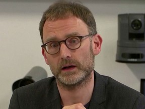 Epidemiologist Neil Ferguson speaks at a news conference in London on January 22, 2020, in this still image taken from video.