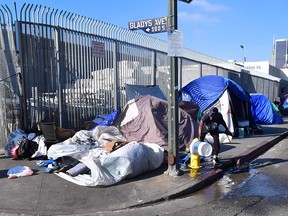 Tents of the homeless line a street corner in Los Angeles, Calif., on Jan. 8, 2020.