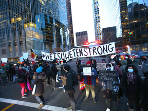 A group of protesters block a Calgary street last month in solidarity with the Wet’suwet’en First Nation. According to the Wet’suwet’en themselves, they'd generally prefer people stop doing this.