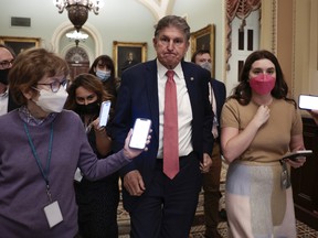 Sen. Joe Manchin (D-WV) leaves a caucus meeting with Senate Democrats at the U.S. Capitol Building on December 17, 2021 in Washington, DC.
