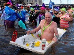 A bare-chested gentleman and his rubber duckies join 1,000 New Year swimmers during the Loony Dook Swim in the River Forth on the morning after 2017  Hogmanay celebrations in Scotland.