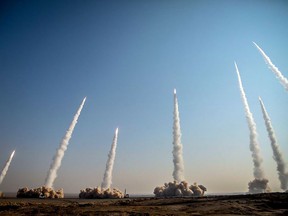 A photo provided by Iran's Revolutionary Guard Corps website via SEPAH News on Jan. 15, 2021, shows a launch of missiles during a military drill in an unknown location in central Iran.