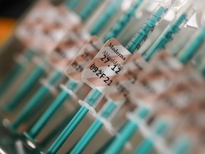Syringes prepared with the Moderna vaccine for COVID-19. Scientists are scrambling to stress-test the jabs to address the new variant threats. (Michaela Handrek-Rehle/Bloomberg)