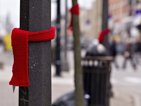 Red scarves hang in downtown Brantford, Ont., for HIV/AIDS Awareness Week in a file photo from Nov. 29, 2019. The number of new HIV cases in Canada increased by 25.3 per cent between 2014 and 2020, something observers blame on a shift in Liberal government priorities.