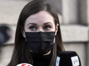 Finnish Prime Minister Sanna Marin holds a news conference outside the Finnish Parliament building in Helsinki, Finland December 8, 2021.