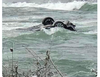 The car involved in a daring rescue at Niagara Falls is now teetering metres from the edge, upside down. (Twitter)