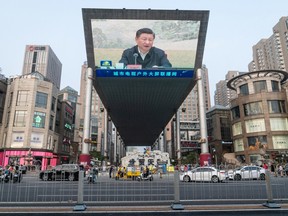 A screen shows a news broadcast of Chinese President Xi Jinping in Beijing, China, on Saturday, June 26, 2021.