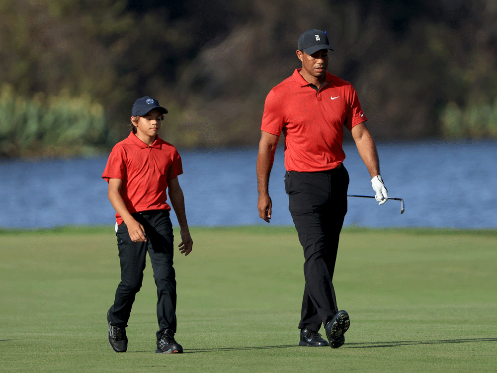 Tiger Woods and son ride 11 straight birdies to finish second to John ...