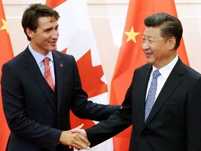 Chinese President Xi Jinping (R) shakes hands with Canadian Prime Minister Justin Trudeau ahead of their meeting at the Diaoyutai State Guesthouse in Beijing, China in August 2016.