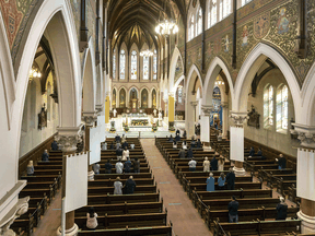 Attendance is sparse at the Easter Sunday service at St. Peter's Cathedral Basilica in London, Ont., amid COVID restrictions, April 4, 2021.