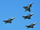 Gripen fighter jets perform over the Danube river in Budapest on August 20, 2019 during an air show.