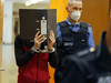 Former Islamic State member Taha al-Jumailly is taken into the courtroom before the judgment is declared in his case, on November 30, 2021 in Frankfurt an Main, Germany.