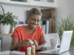 African American woman on a telemedicine call with her doctor