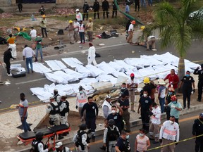 Victims killed after a road accident are laid on the street in body bags after a traffic accident on December 9, 2021 in Tuxtla Gutierrez, Mexico.