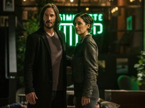 Keanu Reeves and Carrie-Anne Moss stepping out for a simu-latte in The Matrix Resurrections.