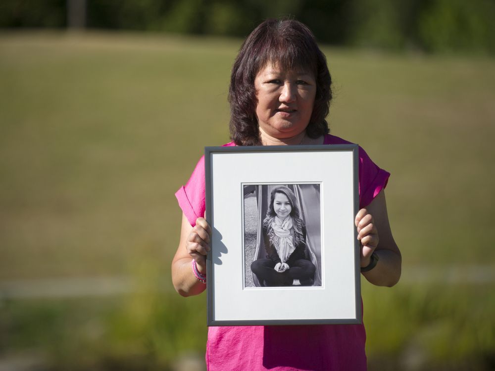 Carol Todd holds a photo of her daughter Amanda Todd, the 15-year-old who committed suicide in October 2012 after being bullied.
