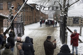 A tour group pictured outside the Auschwitz-Birkenau Memorial and Museum in Oswiecim, Poland in 2018. Yesterday was international Holocaust Remembrance Day, the day being set to coincide with the Jan.  25, 1945 liberation of Auschwitz by the Red Army.  Canada has long had a disproportionately high population of Holocaust survivors;  Montreal has at times had the highest proportion of survivors of any world city barring Tel Aviv or New York.