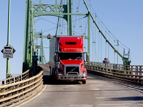 A transport truck enters Ontario over the Thousand Islands Bridge from the United States, in June 2021.