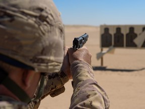 The Canadian military wants to replace its 1940s-era Browning handguns, seen here being used by Canadian troops in the Middle East in 2015.