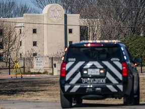 A law enforcement vehicle sits near the Congregation Beth Israel synagogue in Colleyville, Texas, on Jan. 16.