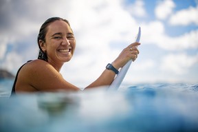 Professional surfer Carissa Moore, the first woman in history to win an Olympic gold medal in the sport, wears her Oura Ring in the ocean.