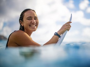 Professional surfer Carissa Moore, the first woman in history to win an Olympic gold medal in the sport, wears her Oura Ring in the ocean.